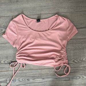 pretty pink and ripped with cute tie bows on the side!